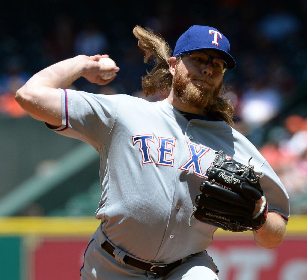 Texas Rangers' A.J. Griffin pitches against the Houston Astros in the first inning of a...