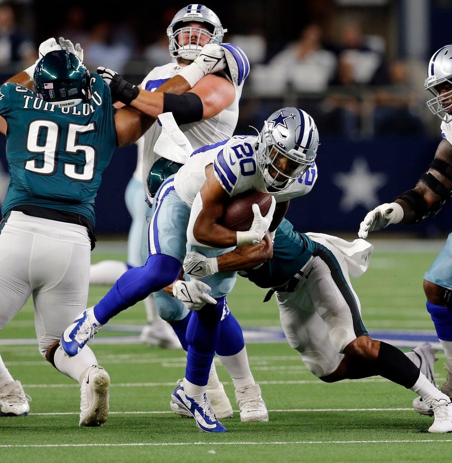 Dallas Cowboys running back Tony Pollard (20) picks up a couple a couple of yards during the first half of a NFL football game between the Dallas Cowboys and the Philadelphia Eagles High at AT&T Stadium in Arlington on Monday, September 27, 2021. (John F. Rhodes / Special Contributor)