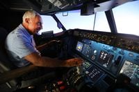 Kevin Sayre with his flight simulator he built in his garage, in Dallas,Texas, Wednesday,...