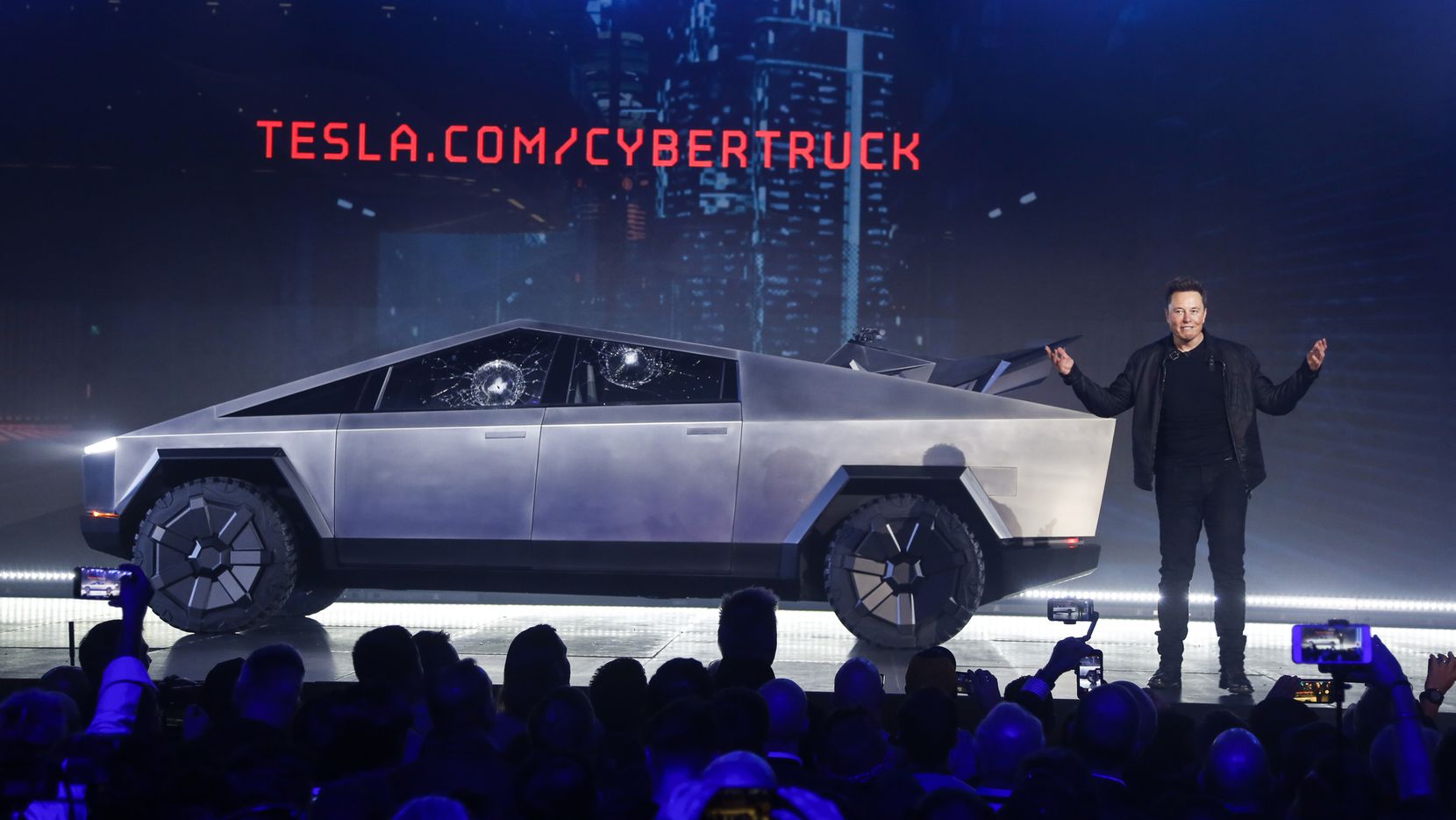 Tesla CEO Elon Musk introduces the Cybertruck at Tesla's design studio on Nov. 21, 2019, in Hawthorne, Calif. Musk is taking on the workhorse heavy pickup truck market with his latest electric vehicle. (AP Photo/Ringo H.W. Chiu)