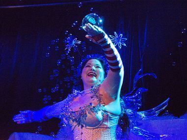 Passionata Fair catches bubbles during her performance Saturday night.