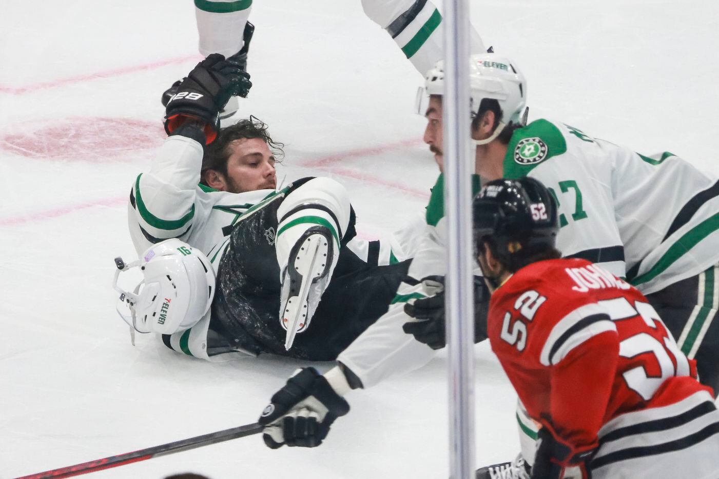 Dallas Stars center Tyler Seguin (91) falls on the ice and loses his helmet during a play in...