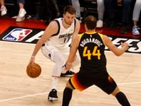 Dallas Mavericks guard Luka Doncic (77) attempts to get by Utah Jazz forward Bojan...