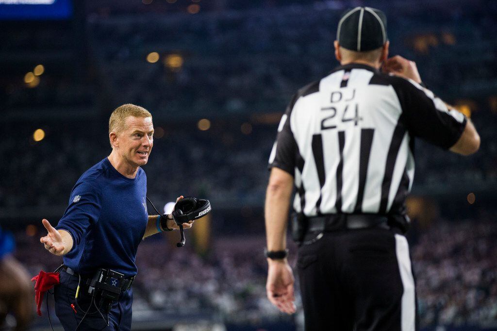 Dallas Cowboys head coach Jason Garrett disputes a call during the fourth quarter of an NFL...