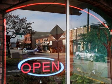 The downtown Mesquite square is reflected in the window of an open restaurant. Another restaurant, Alejandro's at Front Street Station, is set to open in the area in January 2021.