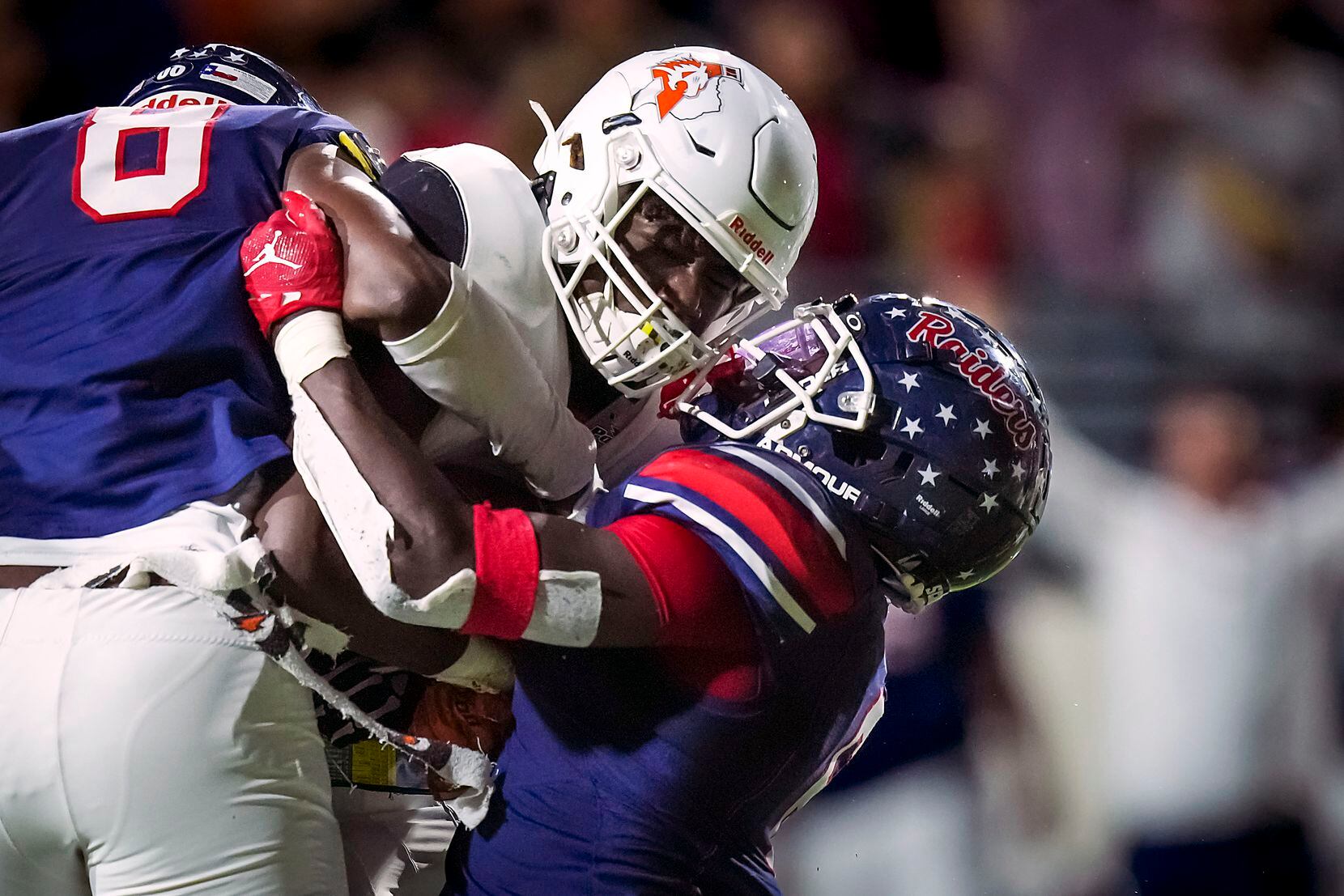 Aledo running back Caleb Pope (34) is brought down by Denton Ryan linebacker Anthony Hill...