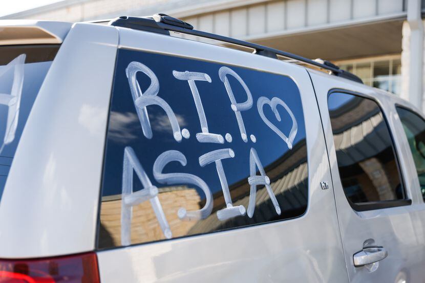 A message honored 21-year-old Asia Womack outside her memorial service in Cedar Hill on...