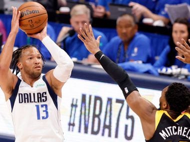 Dallas Mavericks guard Jalen Brunson (13) nails a there-pointer early in the first quarter...