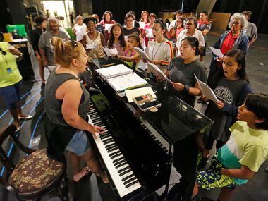 Vonda Bowling, at the keyboard, helps singers rehearse during an Aug. 4 rehearsal for Public...