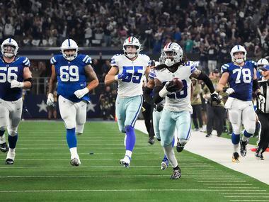 Dallas Cowboys safety Malik Hooker (28) recovers a fumble and returns it for a touchdown...