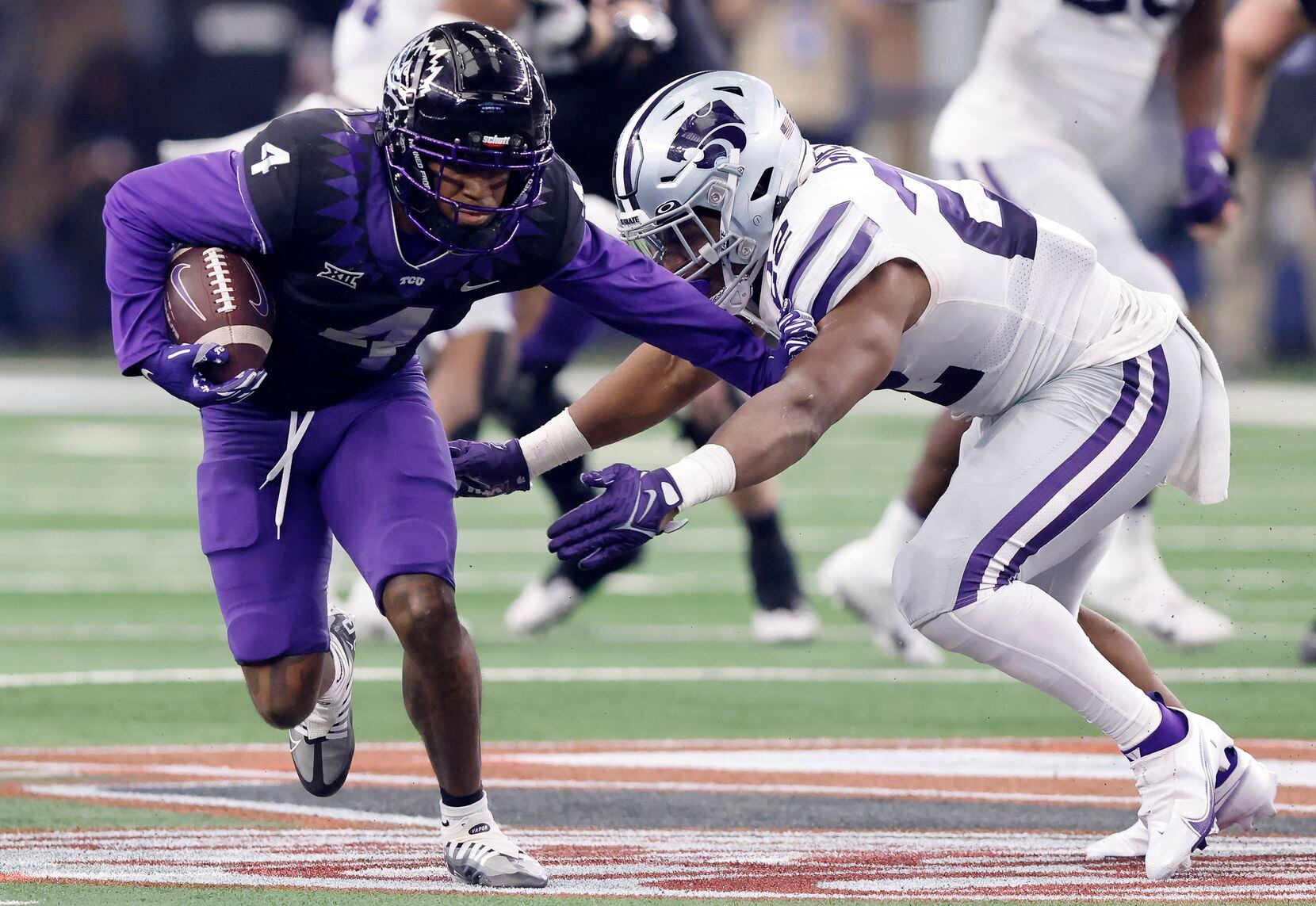 TCU Horned Frogs wide receiver Taye Barber (4) pushes off Kansas State Wildcats linebacker...