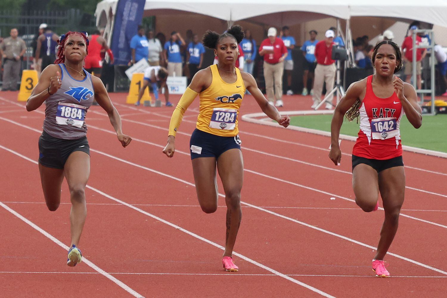 North Crowley's Indya Mayberry (left) won the Class 6A girls 100 meters with a time of...
