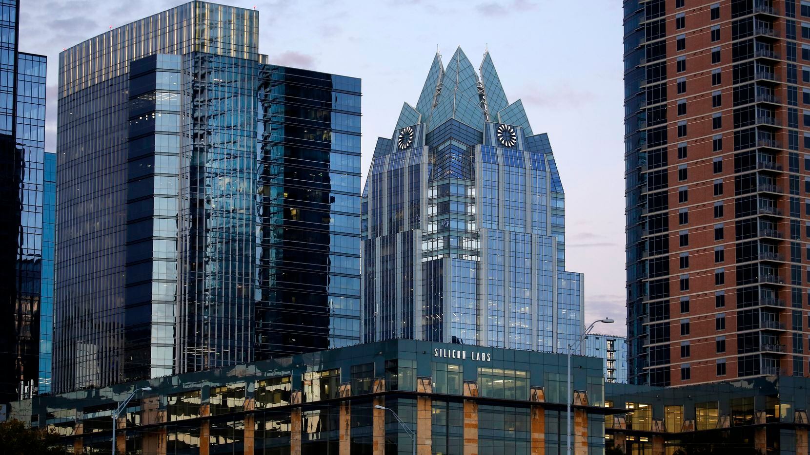 The Frost Bank Tower (with spires) is pictured in downtown Austin. The San Antonio-based...