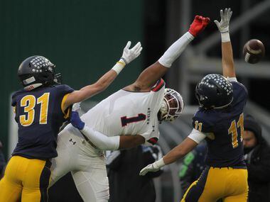Denton Ryan receiver Ja'Tavion Sanders (11) reaches but is unable to pull in a touchdown...