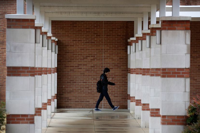Students walk on campus at Collin College in Plano. A Collin College professor who alleges...