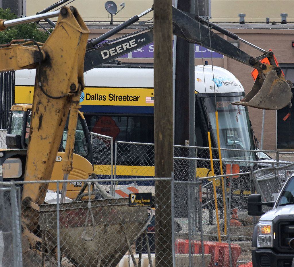 The Dallas streetcar is seen through a maze of construction at the Bishop Arts stop,...