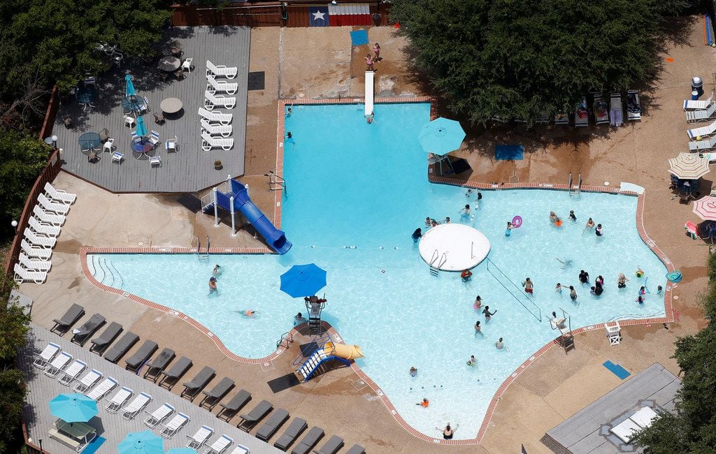 People take a break from the hot weather in The Texas Pool in Plano.