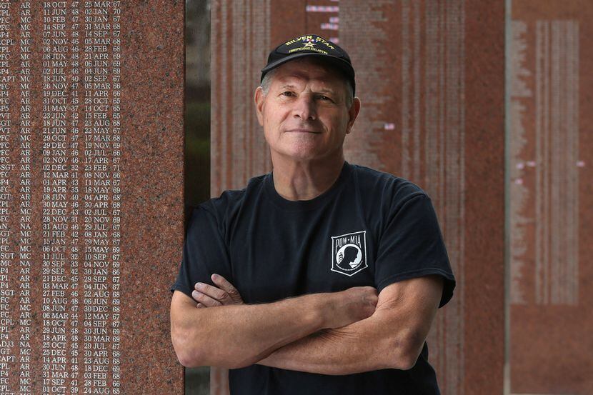 Mike Kuklenski is pictured at the Vietnam Memorial at Fair Park in Dallas. He was a Navy...