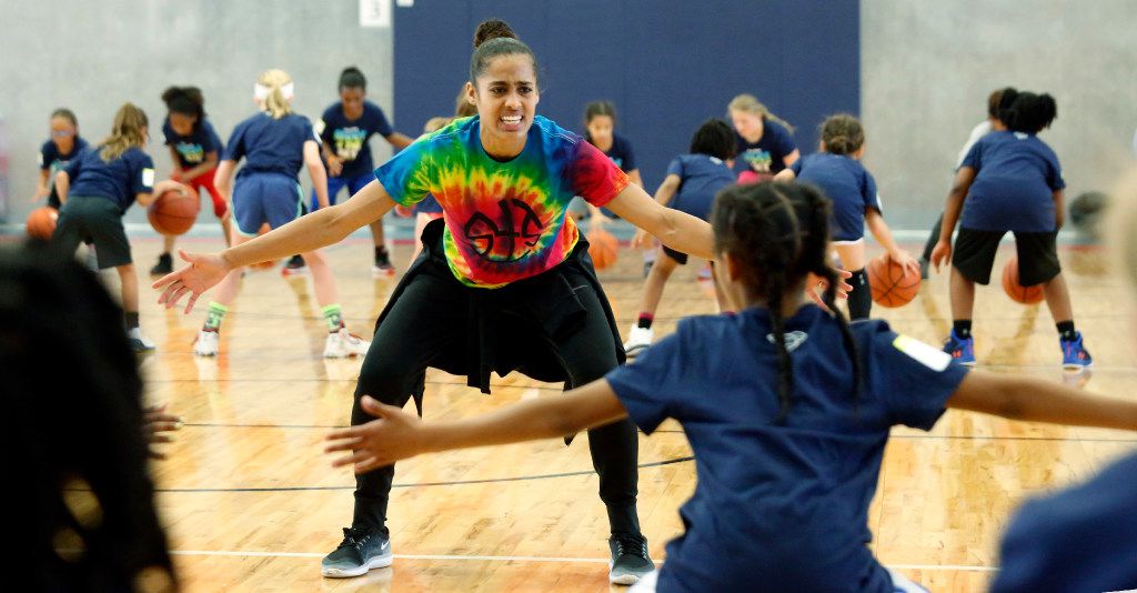 Dallas Wings star Skylar Diggins  leads a defense drill at her basketball camp "Shoot 4 The...
