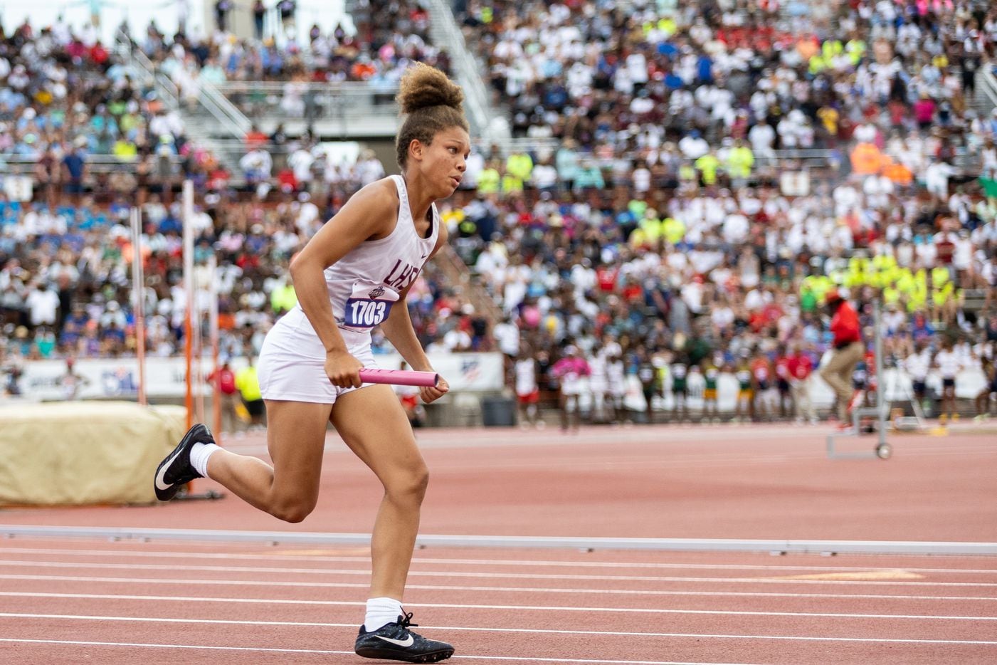Ryan Allen of Lewisville races in the girls’ 4x200-meter relay at the UIL Track & Field...