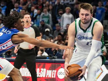 Dallas Mavericks guard Luka Doncic (77) is fouled by Philadelphia 76ers guard Tyrese Maxey...
