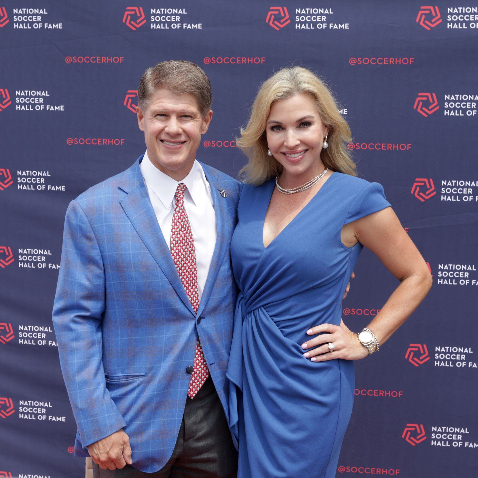 Clark Hunt, left, and his wife Tavia Shackles pose for a photograph during the National...