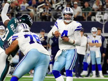 Dallas Cowboys quarterback Dak Prescott (4) looks surprised as he watches his pass during...