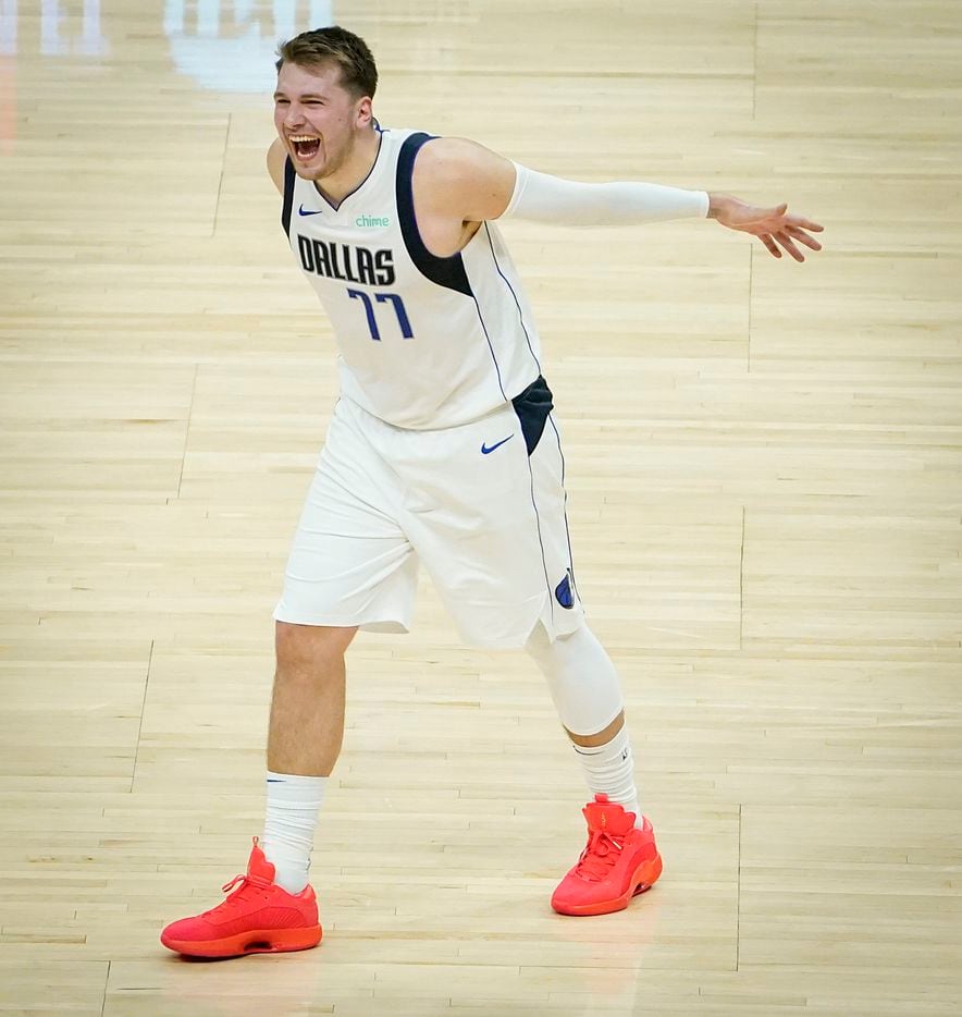 Dallas Mavericks guard Luka Doncic (77) celebrates a 3-pointer by forward Tim Hardaway Jr. during the second half of an NBA playoff basketball game against the LA Clippers at Staples Center on Tuesday, May 25, 2021, in Los Angeles. The Mavericks won the game 127-121.