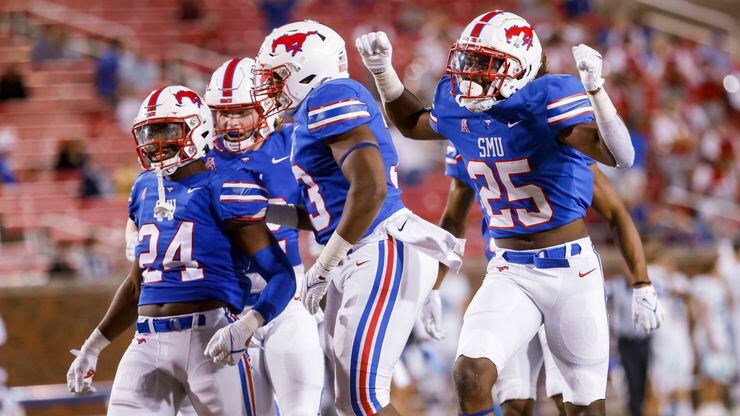 Southern Methodist Mustangs celebrate a tackle during the kick off return during the fourth quarter of a game against the Tulane Green Wave on Thursday, Oct. 21, 2021, at Gerald J. Ford Stadium on the campus of SMU in Dallas. (Juan Figueroa/The Dallas Morning News)