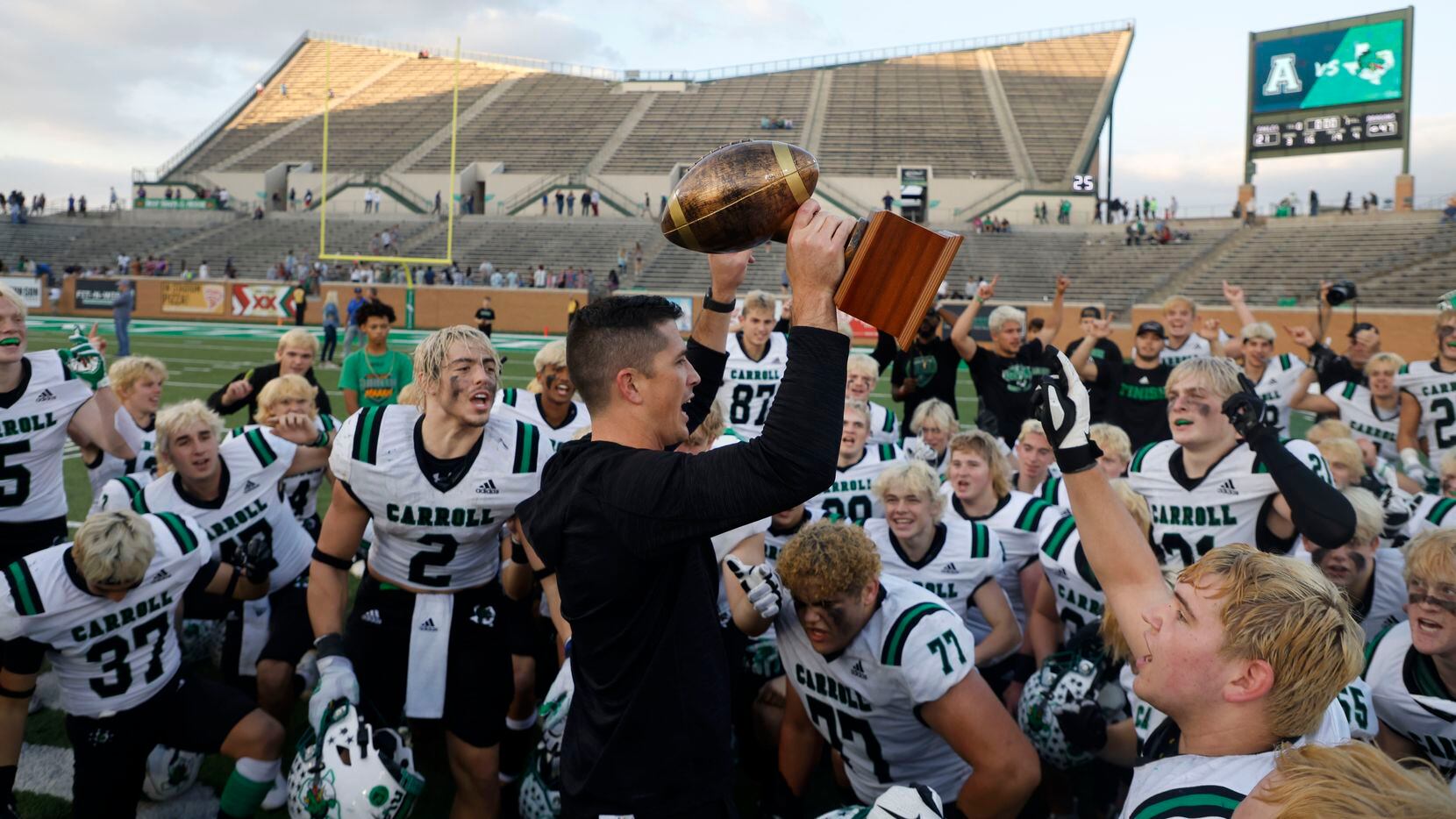 Southlake head coach Riley Dodge holds up the Region I trophy after they defeated Allen 47-21 during a Class 6A Division I Region I final high school football game in Denton, Texas on Saturday, Dec. 4, 2021. (Michael Ainsworth/Special Contributor)