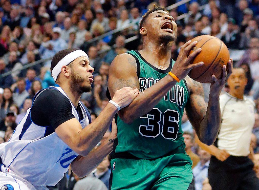Boston Celtics guard Marcus Smart (36), a Flower Mound High grad, is fouled by Dallas...
