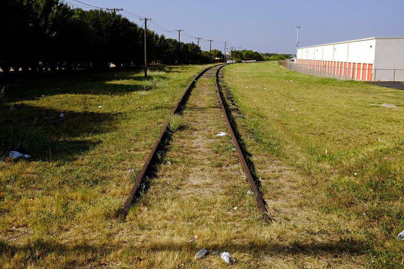 A now-defunct rail line off Parker Road, across from the current DART station, would likely...