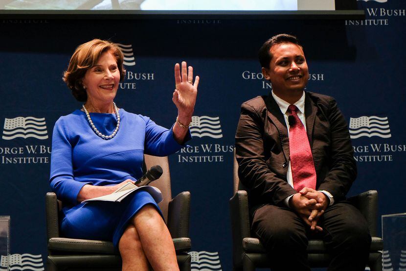 Aung Kyaw Moe, shown here in 2017 with former first lady Laura Bush, recently spoke at the...