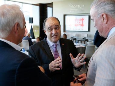 Frisco Mayor Maher Maso (center) talks with Jim Lites (left), Dallas Stars President and...