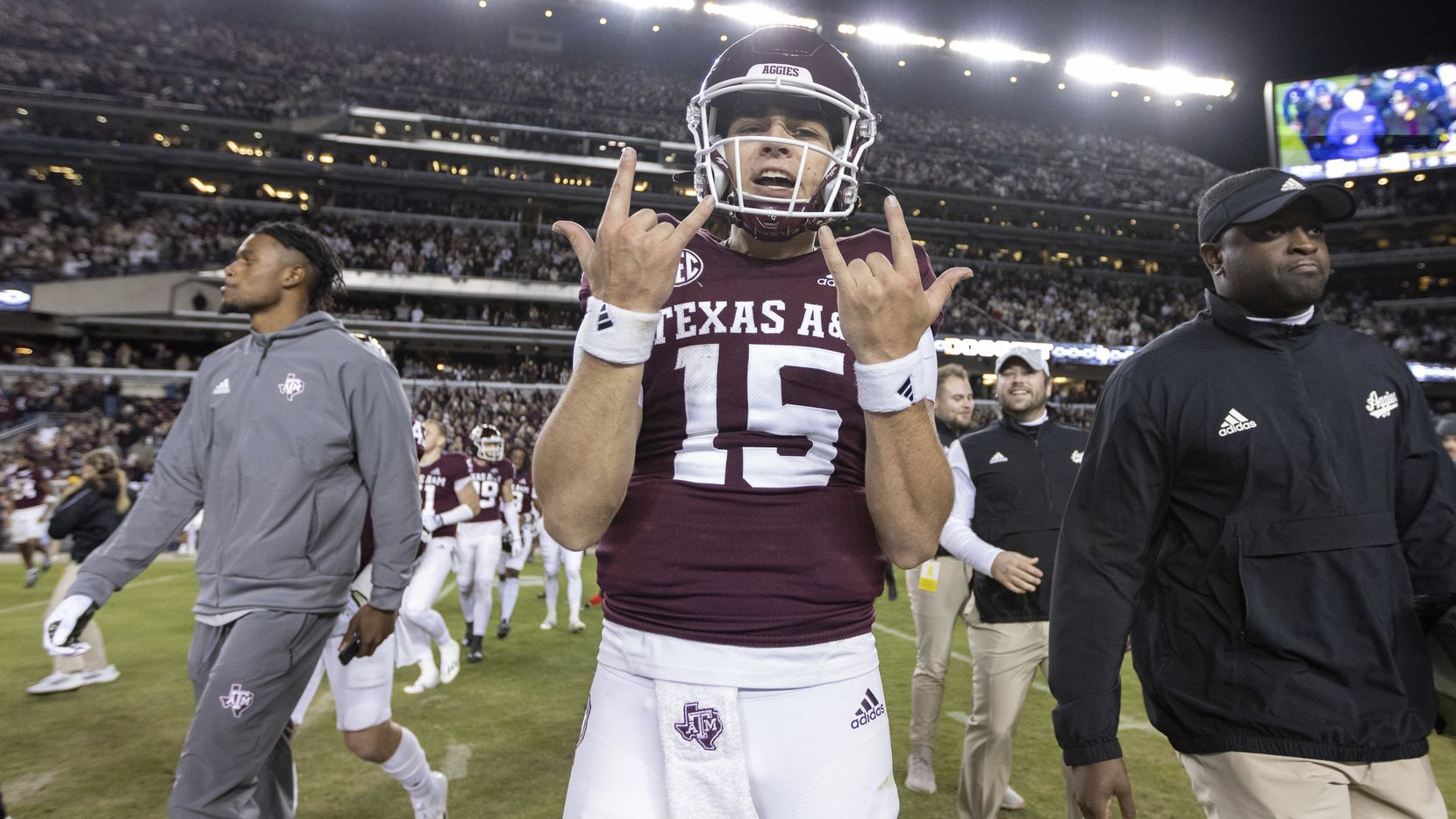 Texas A&M quarterback Conner Weigman (15) celebrates after the team's NCAA college football...