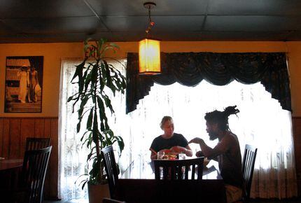 In this DMN file photo, two customers eat dinner at Mai's Restaurant in Dallas. Mai's was a...