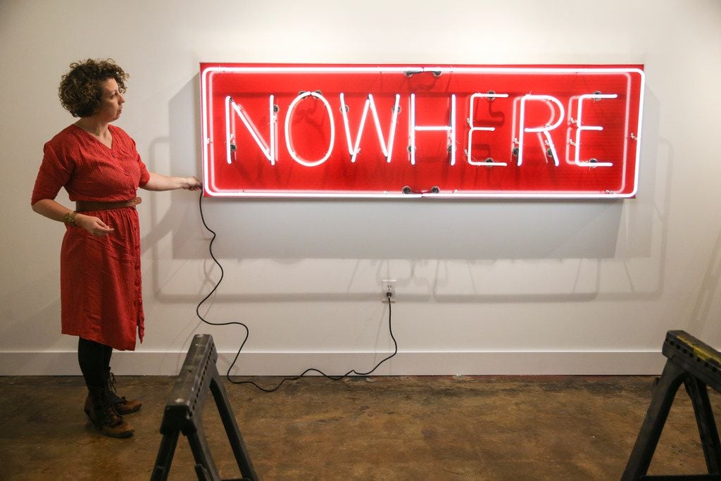 Alicia Eggert illuminates her neon sculpture NOW/HERE at the Mac in Dallas' Cedars...