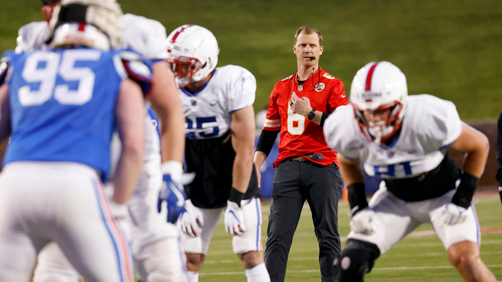 Coach Rhett Lashlee watches as players play during the SMU Football annual spring game at...