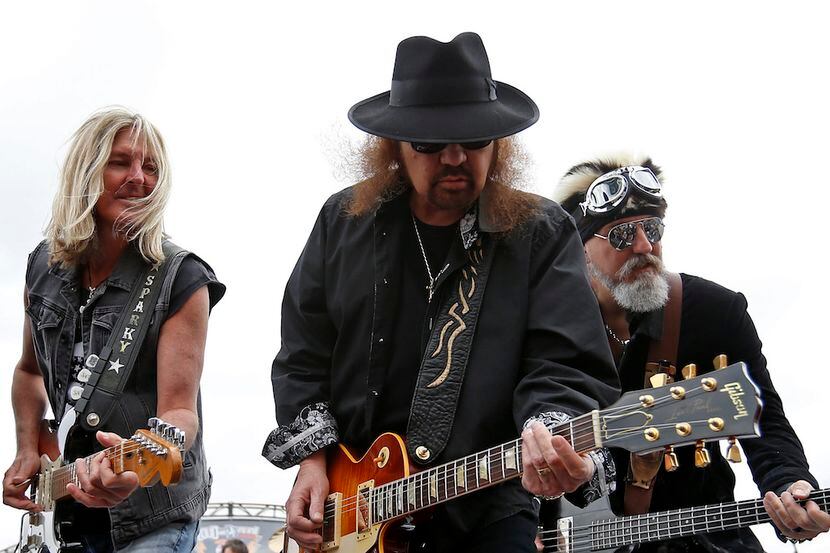 Members of Lynyrd Skynyrd perform onstage at Texas Motor Speedway.