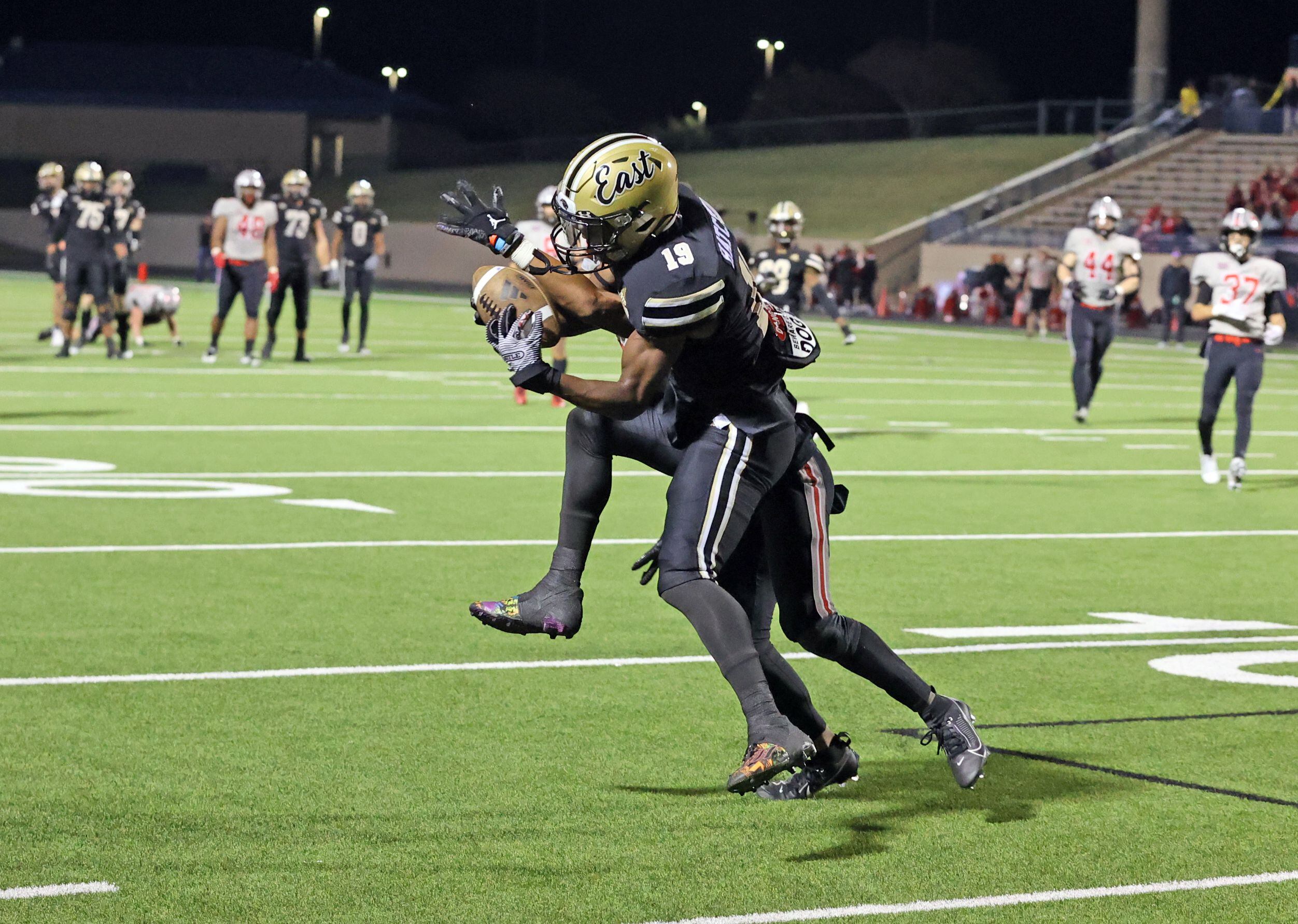 Plano East high WR Jaylon Hatcher (19) catches a pass, and takes it to the end zone for a...