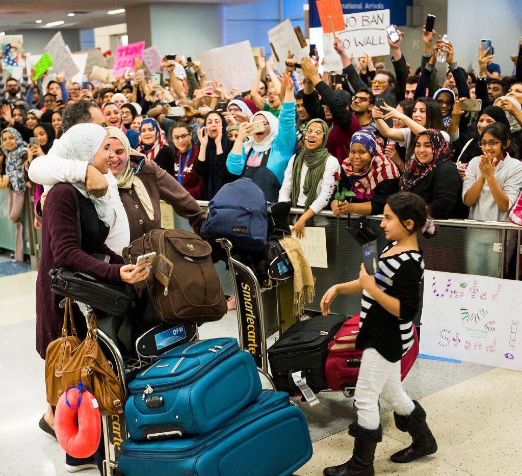 Protestors opposed to President Donald Trump's executive order barring certain travelers...