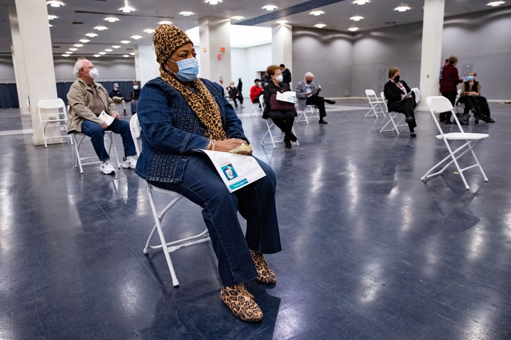Gladys Rodgers, 77, waits after receiving the COVID-19 vaccine in the post vaccination waiting area at Fair Park in Dallas on Thursday, Jan. 14, 2021. A limited number of COVID-19 vaccine shots will be available Thursday at Fair Park for North Texans 75 and older. (Juan Figueroa/ The Dallas Morning News)