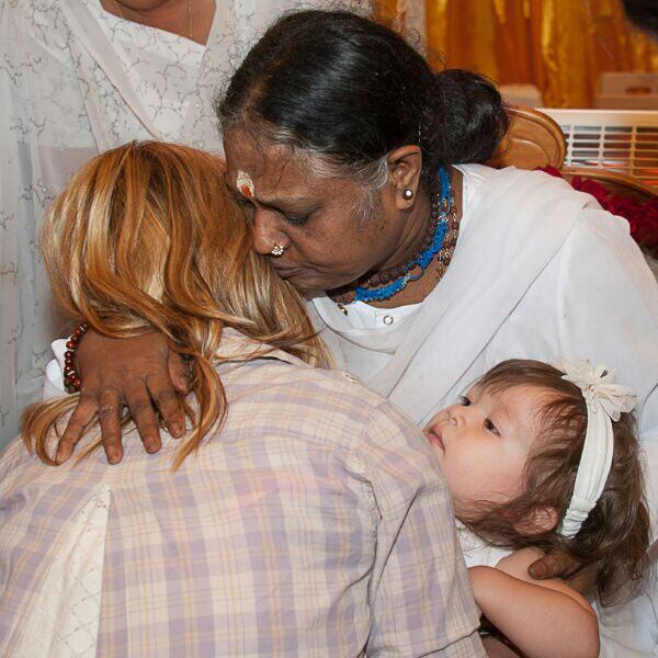 
Mata Amritanandamayi Devi, the Hugging Saint of India, hugs guests during the Dallas stop...
