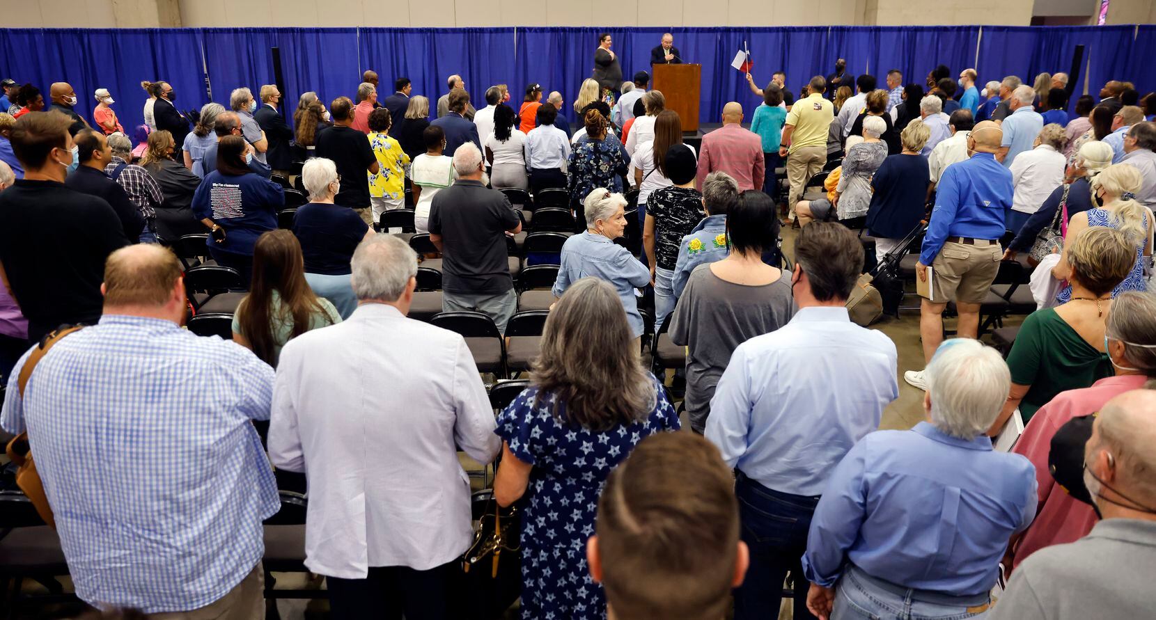 Texas Democratic Party Chairman Gilberto Hinojosa (center, at podium) leads the SDEC (State...