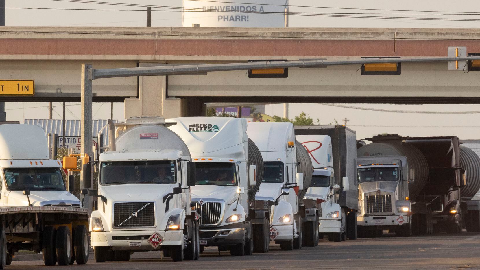 A line of drivers form as they head south toward the recently reopened Pharr–Reynosa...