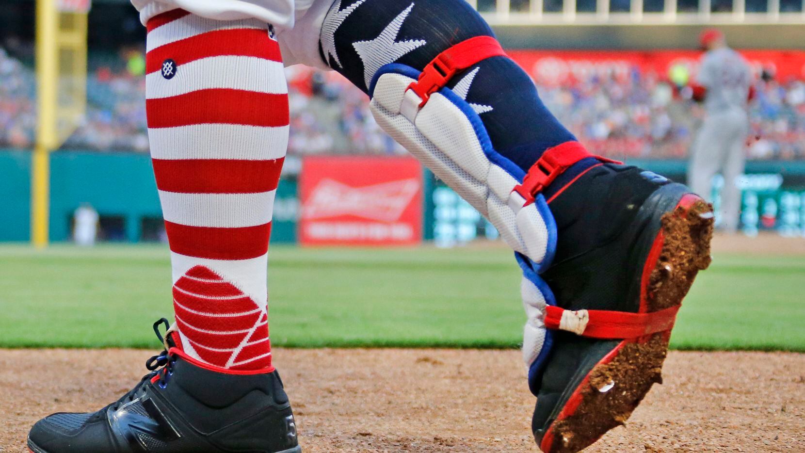 FILE - Rangers second baseman Rougned Odor (12) sports patriotic socks during a game against...
