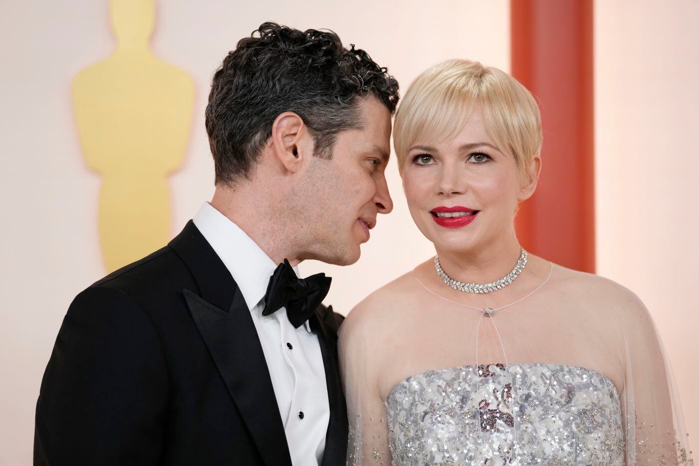Thomas Kail, left, and Michelle Williams arrive at the Oscars on Sunday, March 12, 2023, at...