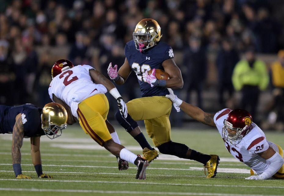 Notre Dame Fighting Irish running back C.J. Prosise (20) is pursued by Southern California...