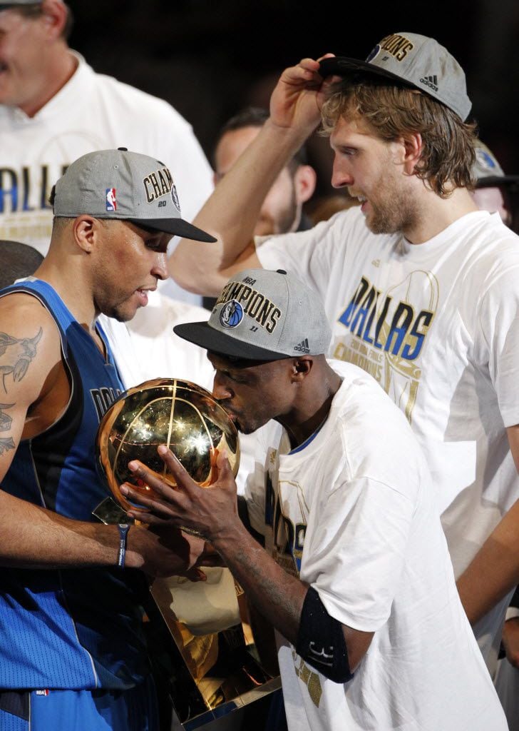 Dallas Mavericks shooting guard Jason Terry (31) kisses the NBA Championship Larry O'Brien...