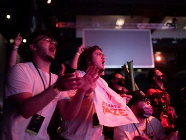 Hunter McDowell, center, cheers as the Atlanta FaZe win the first map during OpTic Texas'...